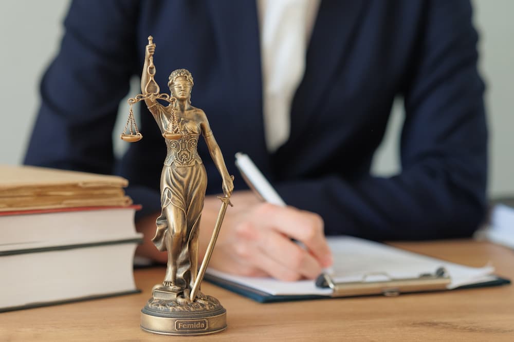 lawyer writing on desk